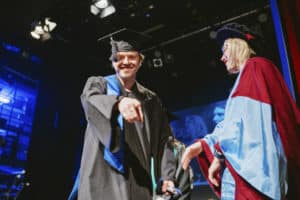 Students on stage at the BIMM Berlin graduation 2022