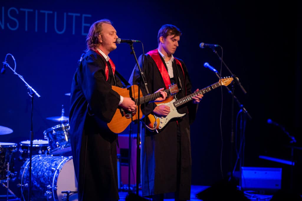 Students performing at graduation