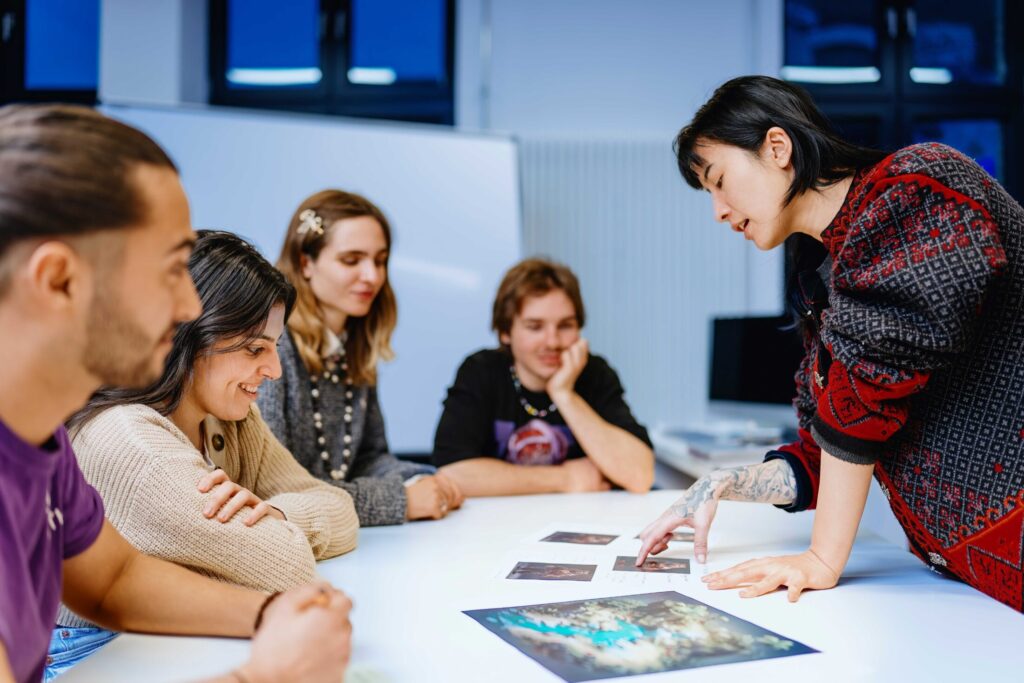 BIMM Berlin game design students-around-a-table-talking
